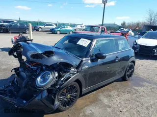 2024 MINI Hardtop 2 Door Cooper SE with VIN WMW13DJ03R2V25523, listed as a IAAI auction lot 41585964 with 7,690 mi miles. Bid and sale history available at carsss.com. Image 2.