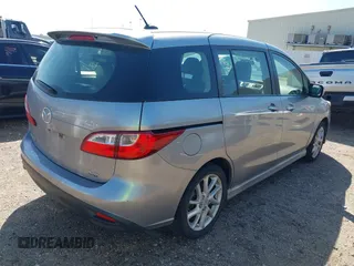 2012 Mazda Mazda5 Grand Touring with VIN JM1CW2DL2C0129518, listed as a IAAI auction lot 41872136 with 129,323 mi miles. Bid and sale history available at carsss.com. Image 4.