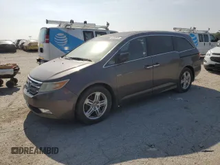 2012 Honda Odyssey Touring z VIN 5FNRL5H91CB023159, wystawiony jako Copart lot #66232515 z przebiegiem Nie podano mil oraz Czysty tytuł • Clean title. Historia ofert i sprzedaży dostępna na DreamBid. Obrazek 1.