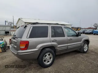1999 Jeep Grand Cherokee Limited with VIN 1J4GW68SXXC582343, listed as a Copart auction lot 51067695 with 157,456 mi miles and Clean Title. Bid and sale history available at carsss.com. Image 3.
