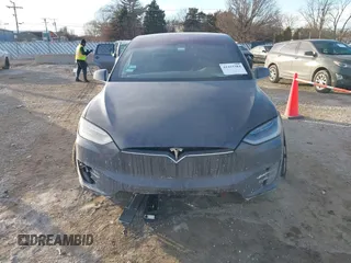 2017 Tesla Model X 90D with VIN 5YJXCDE23HF051321, listed as a IAAI auction lot 41415384 with 127,476 mi miles and . Bid and sale history available at carsss.com. Image 11.