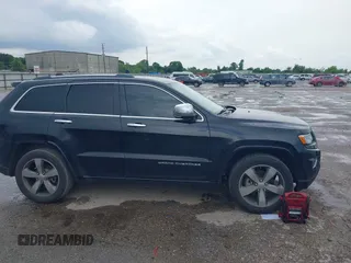2015 Jeep Grand Cherokee Overland with VIN 1C4RJECG1FC769950, listed as a IAAI auction lot 42405712 with 217,514 mi miles and . Bid and sale history available at DreamBid. Image 13.