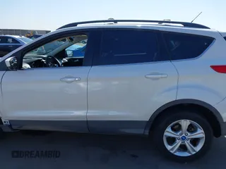 2013 Ford Escape SE with VIN 1FMCU0GX9DUB83638, listed as a IAAI auction lot 42471869 with 213,356 mi miles and . Bid and sale history available at DreamBid. Image 15.