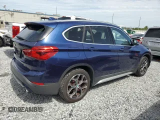 2020 BMW X1 xDrive28i with VIN WBXJG9C0XL5R33141, listed as a Copart auction lot 63040155 with 165,172 mi miles and Clean title. Bid and sale history available at DreamBid. Image 3.
