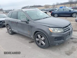 2012 Volkswagen Touareg Sport with VIN WVGFK9BPXCD001085, listed as a IAAI auction lot 41470065 with 200,000 mi miles and . Bid and sale history available at DreamBid. Image 1.