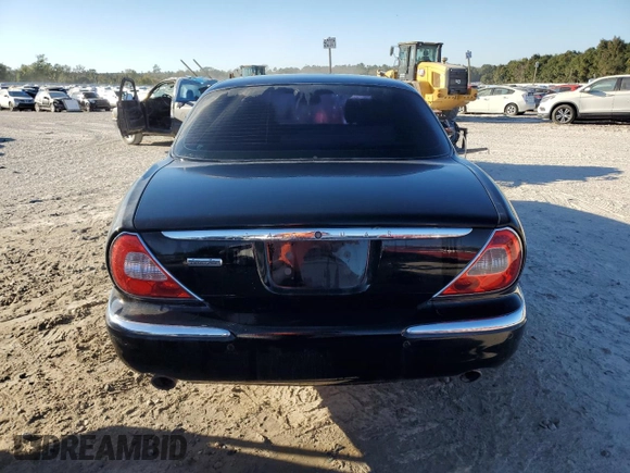 2005 Jaguar XJ Vanden Plas z VIN SAJWA82C05SG47513, wystawiony jako Copart lot #75428654 z przebiegiem 157 442 mil mil oraz Szkoda całkowita • Salvage title. Historia ofert i sprzedaży dostępna na DreamBid. Obrazek 6.