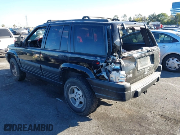 1998 Jeep Grand Cherokee Laredo with VIN 1J4FX58S8WC121904, listed as a IAAI auction lot 41145207 with 222,134 mi miles. Bid and sale history available at carsss.com. Image 3.