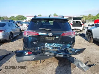 2018 Toyota RAV4 LE with VIN JTMZFREV1JJ203943, listed as a IAAI auction lot 41921863 with 104,691 mi miles. Bid and sale history available at carsss.com. Image 16.