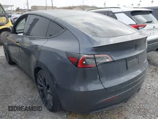 2023 Tesla Model Y Performance z VIN 7SAYGDEF6PF774965, wystawiony jako IAAI lot #41655550 z przebiegiem 33 824 mil mil oraz . Historia ofert i sprzedaży dostępna na DreamBid. Obrazek 3.
