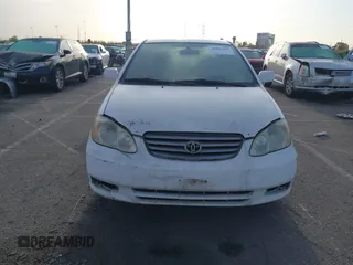 2004 Toyota Corolla CE with VIN JTDBR32E042025208, listed as a IAAI auction lot 41934485 with 299,999 mi miles. Bid and sale history available at carsss.com. Image 6.