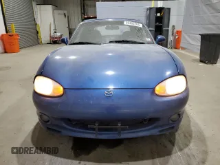 1999 Mazda MX-5 Miata with VIN JM1NB3532X0136645, listed as a Copart auction lot 59480265 with 160,936 mi miles and Clean title. Bid and sale history available at DreamBid. Image 5.