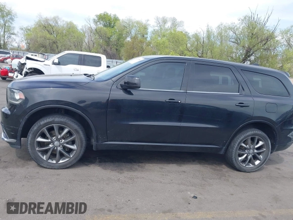 2015 Dodge Durango SXT with VIN 1C4RDJAGXFC796034, listed as a IAAI auction lot 42057983 with 159,108 mi miles and . Bid and sale history available at DreamBid. Image 14.