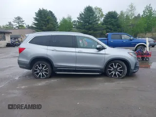 2020 Honda Pilot Touring 8-Passenger z VIN 5FNYF6H91LB042626, wystawiony jako IAAI lot #42249440 z przebiegiem 57 429 mil mil oraz . Historia ofert i sprzedaży dostępna na DreamBid. Obrazek 13.