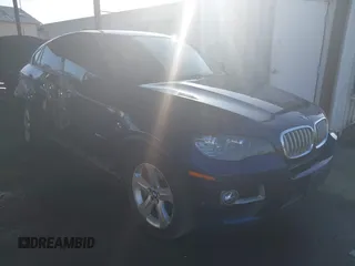 2013 BMW X6 xDrive50i with VIN 5UXFG8C51DL591955, listed as a IAAI auction lot 41392374 with 112,899 mi miles. Bid and sale history available at carsss.com. Image 1.