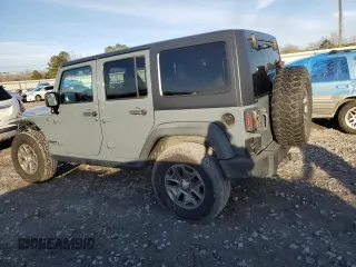 2015 Jeep Wrangler Unlimited Rubicon with VIN 1C4BJWFG7FL732694, listed as a Copart auction lot 42977435 with 128,759 mi miles and Salvage Title. Bid and sale history available at carsss.com. Image 2.