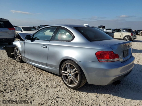 2011 BMW 1 Series 135i with VIN WBAUC9C59BVM11260, listed as a Copart auction lot 86721684 with 56,914 mi miles and Salvage Title. Bid and sale history available at carsss.com. Image 2.