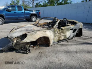 1999 Porsche Boxster z VIN WP0CA2986XU620689, wystawiony jako Copart lot #57245575 z przebiegiem Nie podano mil oraz Szkoda całkowita • Salvage title. Historia ofert i sprzedaży dostępna na DreamBid. Obrazek 1.