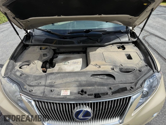 2012 Lexus RX 450h z VIN JTJBC1BA5C2427885, wystawiony jako Copart lot #58626695 z przebiegiem 166 056 mil mil oraz Szkoda całkowita • Salvage title. Historia ofert i sprzedaży dostępna na DreamBid. Obrazek 7.