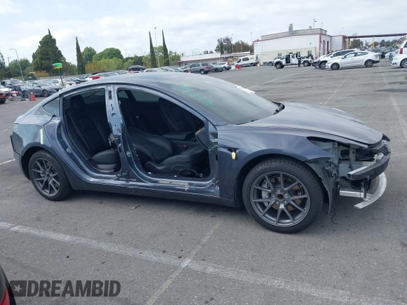 2023 Tesla Model 3 with VIN 5YJ3E1EA4PF410060, listed as a IAAI auction lot 42067624 with 59,934 mi miles and . Bid and sale history available at DreamBid. Image 13.