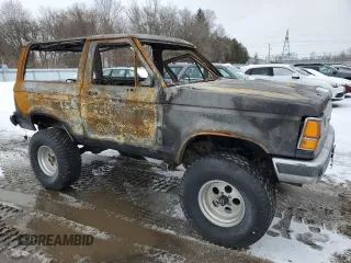 1987 Ford Bronco с VIN 1FMCU14T3HUC77415, выставлен на аукционе Copart как лот 47737825 с пробегом Не указан миль и На запчасти • Non repairable. История ставок и продаж доступна на DreamBid. Изображение 4.
