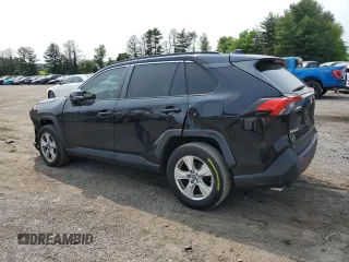 2019 Toyota RAV4 XLE with VIN JTMP1RFV8KJ001784, listed as a Copart auction lot 59109235 with 98,858 mi miles and Salvage title. Bid and sale history available at DreamBid. Image 2.