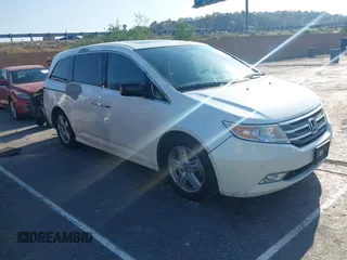 2013 Honda Odyssey Touring with VIN 5FNRL5H93DB002928, listed as a IAAI auction lot 42418775 with 141,867 mi miles and . Bid and sale history available at DreamBid. Image 1.