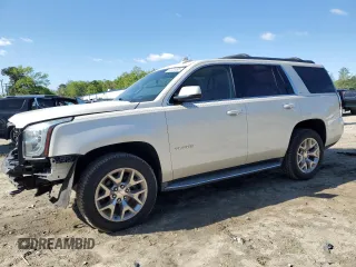 2015 GMC Yukon SLT with VIN 1GKS2BKC5FR646293, listed as a Copart auction lot 52020095 with 52,387 mi miles and Salvage Title. Bid and sale history available at carsss.com. Image 1.