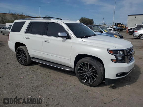 2018 Chevrolet Tahoe Premier with VIN 1GNSKCKC6JR195246, listed as a Copart auction lot 54887165 with 135,973 mi miles and Salvage title. Bid and sale history available at DreamBid. Image 4.