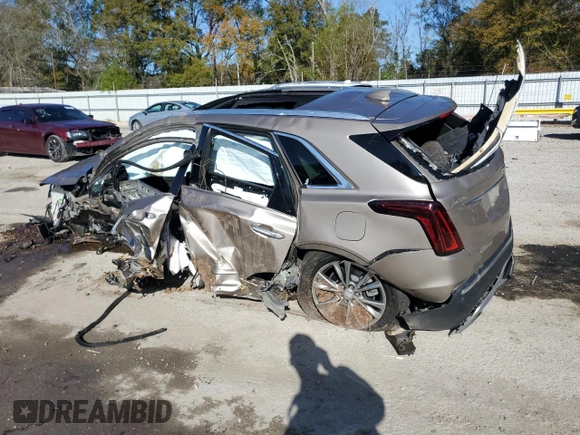 2022 Cadillac XT5 FWD Premium Luxury z VIN 1GYKNCRS8NZ112882, wystawiony jako Copart lot #86999544 z przebiegiem Nie podano mil oraz Szkoda całkowita • Salvage title. Historia ofert i sprzedaży dostępna na DreamBid. Obrazek 2.