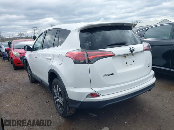 2018 Toyota RAV4 LE with VIN 2T3BFREVXJW793174, listed as a IAAI auction lot 42037936 with 82,304 mi miles. Bid and sale history available at carsss.com. Image 3.