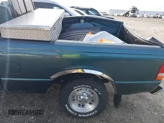 1997 Ford Ranger XLT z VIN 1FTCR10A6VUA47101, wystawiony jako IAAI lot #41743587 z przebiegiem 87 277 mil mil oraz . Historia ofert i sprzedaży dostępna na DreamBid. Obrazek 20.