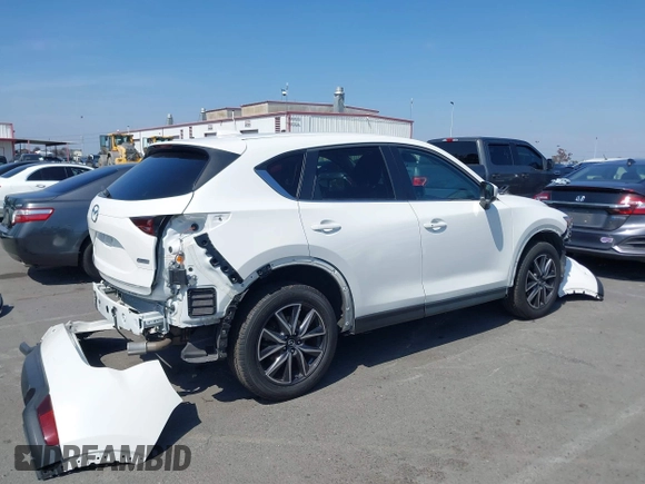 2018 Mazda CX-5 Touring with VIN JM3KFACM0J0416716, listed as a IAAI auction lot 42150121 with 61,332 mi miles and . Bid and sale history available at carsss.com. Image 14.
