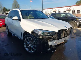 2021 BMW X5 sDrive40i with VIN 5UXCR4C07M9F23816, listed as a IAAI auction lot 41871364 with 55,401 mi miles. Bid and sale history available at carsss.com. Image 1.