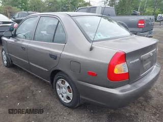 2002 Hyundai Accent GL z VIN KMHCG45C52U372587, wystawiony jako IAAI lot #42244428 z przebiegiem 43 538 mil mil oraz . Historia ofert i sprzedaży dostępna na DreamBid. Obrazek 3.