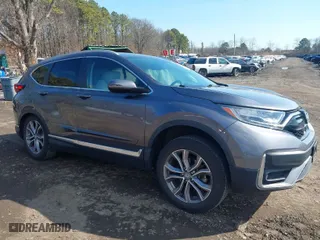 2021 Honda CR-V Touring with VIN 2HKRW2H9XMH645901, listed as a IAAI auction lot 41870446 with 22,996 mi miles. Bid and sale history available at carsss.com. Image 1.