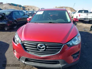 2016 Mazda CX-5 Touring with VIN JM3KE4CY0G0901356, listed as a IAAI auction lot 41641742 with 96,950 mi miles. Bid and sale history available at carsss.com. Image 12.