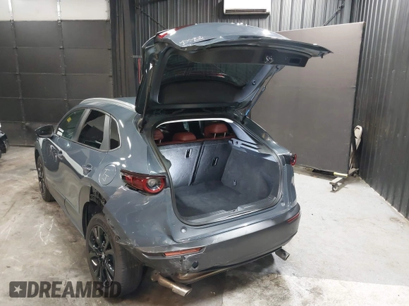 2022 Mazda CX-30 S Carbon Edition with VIN 3MVDMBCL8NM447234, listed as a IAAI auction lot 42511600 with 51,926 mi miles and . Bid and sale history available at DreamBid. Image 3.