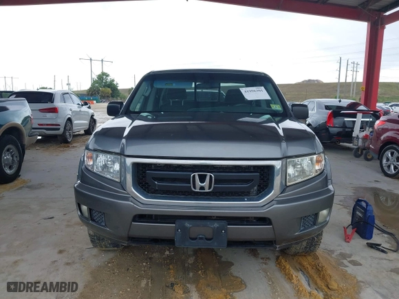 2009 Honda Ridgeline RT with VIN 2HJYK16279H501015, listed as a IAAI auction lot 41996301 with 124,716 mi miles. Bid and sale history available at carsss.com. Image 12.
