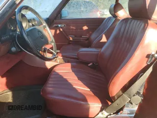 1987 Mercedes-Benz 560 SL with VIN WDBBA48D6HA057618, listed as a Copart auction lot 43252525 with 86,855 mi miles and Salvage Title. Bid and sale history available at DreamBid. Image 7.