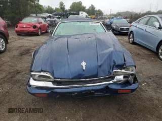 1995 Jaguar XJS with VIN SAJNX2741SC198516, listed as a Copart auction lot 69795314 with 75,227 mi miles and Salvage Title. Bid and sale history available at carsss.com. Image 5.