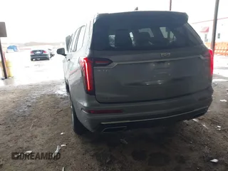 2022 Cadillac XT6 Premium Luxury z VIN 1GYKPDRS1NZ108012, wystawiony jako IAAI lot #41178333 z przebiegiem 83 987 mil mil oraz . Historia ofert i sprzedaży dostępna na DreamBid. Obrazek 3.