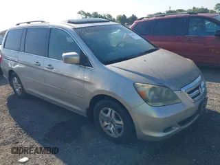 2005 Honda Odyssey EX-L z VIN 5FNRL38625B412048, wystawiony jako IAAI lot #42838625 z przebiegiem 222 689 mil mil oraz . Historia ofert i sprzedaży dostępna na DreamBid. Obrazek 1.