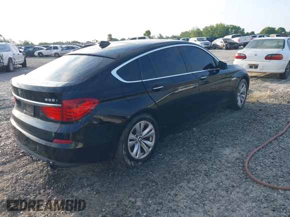 2013 BMW 5 Series GT 535i xDrive with VIN WBASP2C50DC338989, listed as a IAAI auction lot 42041585 with 121,429 mi miles. Bid and sale history available at carsss.com. Image 4.