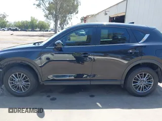 2019 Mazda CX-5 Sport with VIN JM3KFABM7K1509987, listed as a IAAI auction lot 42062804 with 50,898 mi miles and . Bid and sale history available at DreamBid. Image 15.