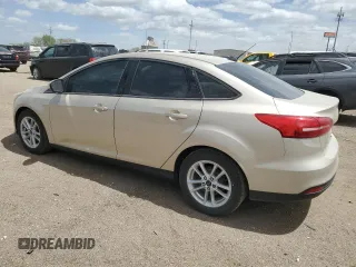 2017 Ford Focus SE with VIN 1FADP3F28HL299535, listed as a Copart auction lot 56958885 with 102,179 mi miles and Clean title. Bid and sale history available at DreamBid. Image 2.