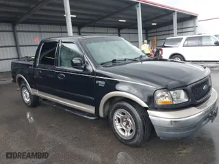 2001 Ford F-150 SuperCrew XLT with VIN 1FTRW07LX1KB77165, listed as a IAAI auction lot 41940550 with 191,021 mi miles. Bid and sale history available at carsss.com. Image 1.