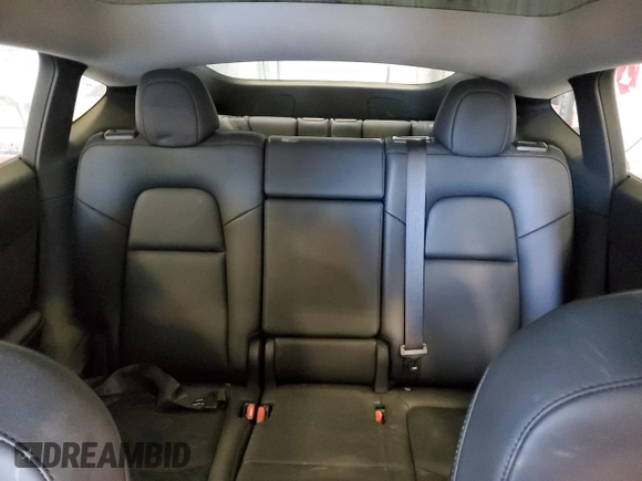 2023 Tesla Model Y Long Range z VIN 7SAYGAEE5PF672546, wystawiony jako Copart lot #42779065 z przebiegiem 27 570 mil mil oraz Nie do naprawy • Non repairable. Historia ofert i sprzedaży dostępna na DreamBid. Obrazek 10.