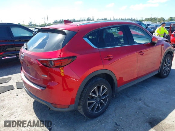 2018 Mazda CX-5 Grand Touring with VIN JM3KFADM0J0377091, listed as a IAAI auction lot 41677544 with 91,758 mi miles. Bid and sale history available at carsss.com. Image 4.