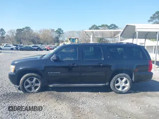 2011 Chevrolet Suburban LT with VIN 1GNSCJE06BR402433, listed as a IAAI auction lot 41819335 with 203,335 mi miles. Bid and sale history available at carsss.com. Image 14.