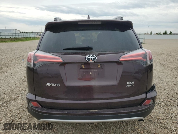 2016 Toyota RAV4 XLE with VIN 2T3RFREV0GW517044, listed as a Copart auction lot 59749195 with 81,834 mi miles and Salvage title. Bid and sale history available at DreamBid. Image 6.